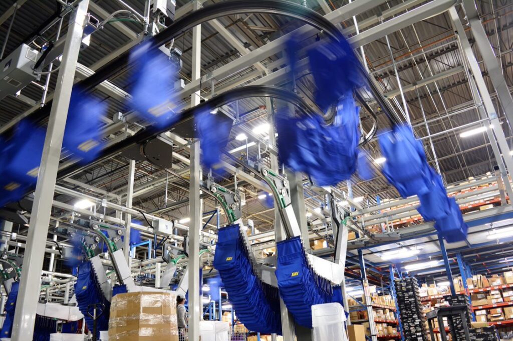 Joey system moving along conveyor system.
